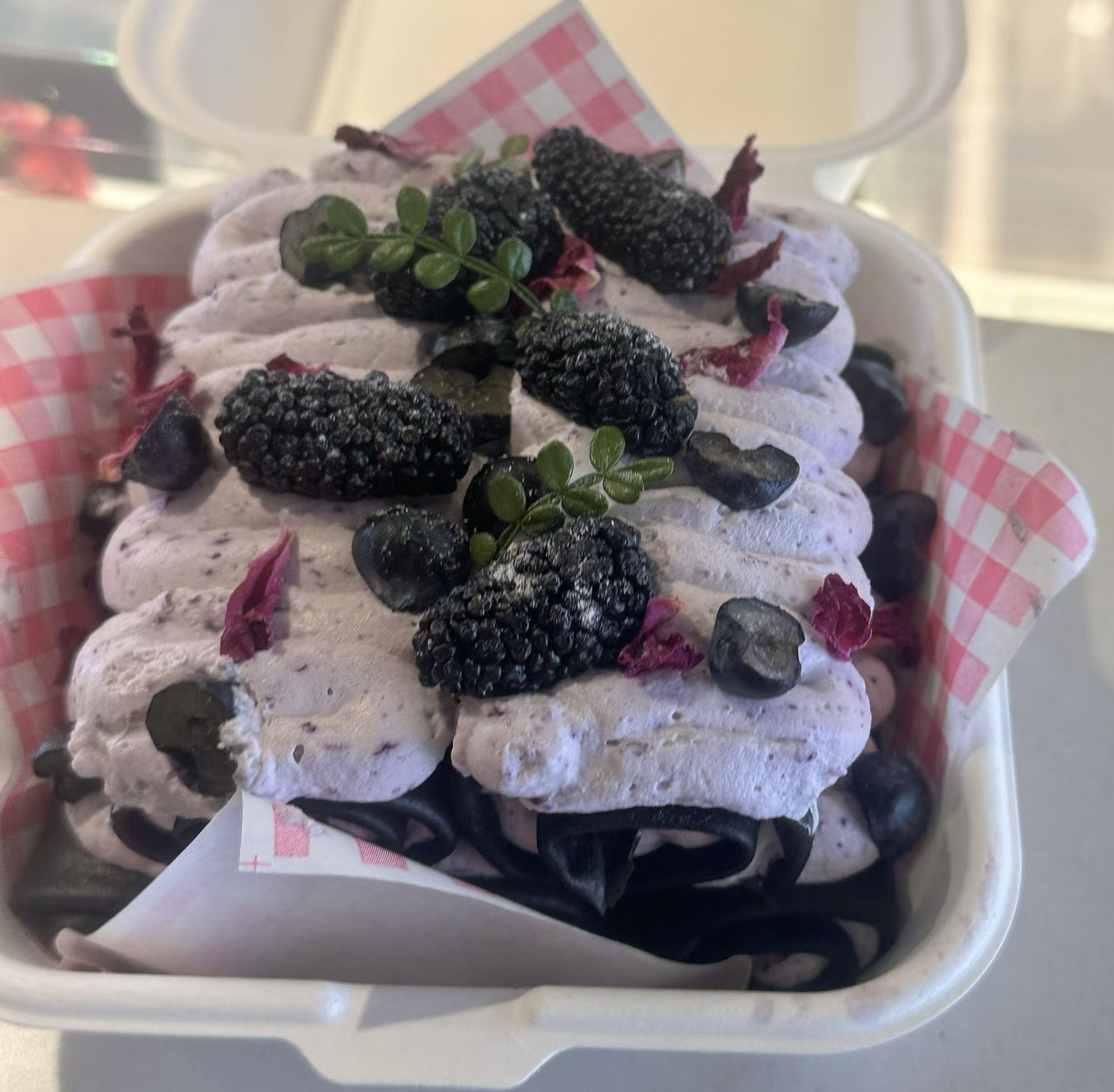 Blueberry towel roll topped with blueberries and berries.